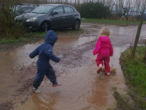 Jumping in Car Park Puddles